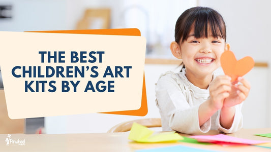 Smiling girl holding up her completed art project from children’s art kits