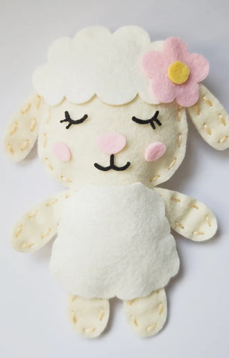 Finished felt lamb plushie with a pink flower, from the Bunny and Friends Sewing Kit