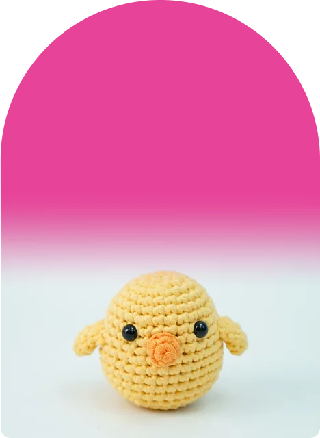 A sunny yellow chick with an orange beak and tiny wings, round as a ball