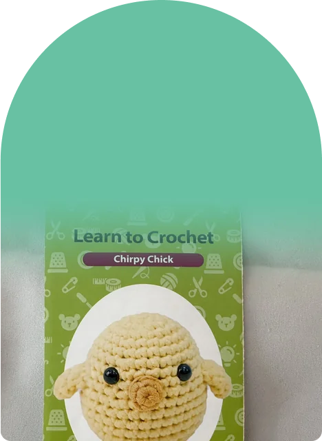 A printed pattern and a ball of yarn, a craft that keeps hands busy and screens off