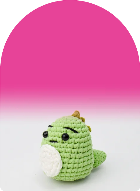 A green dino with a white belly, olive spikes, and a brow that means business