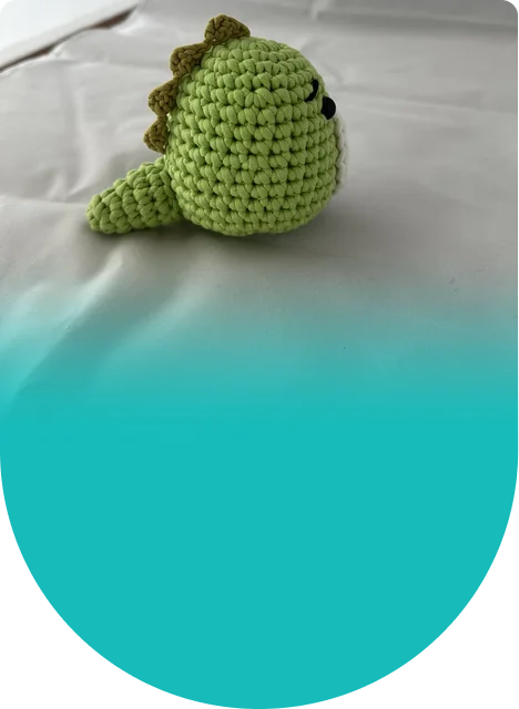A cuddly sidekick for any dinosaur fan, made by hand and ready for hugs