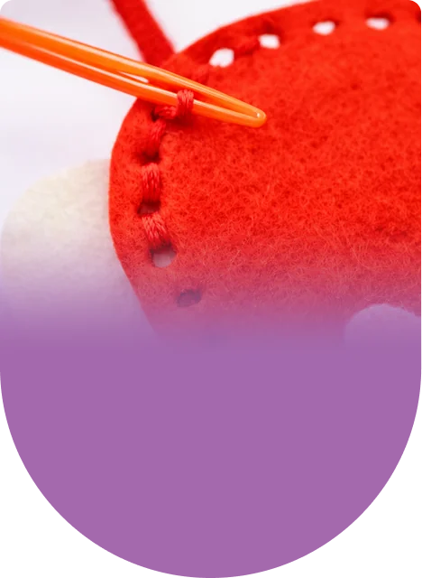 Stitch, stuff, and finish the red bug, then do it again for the pink one