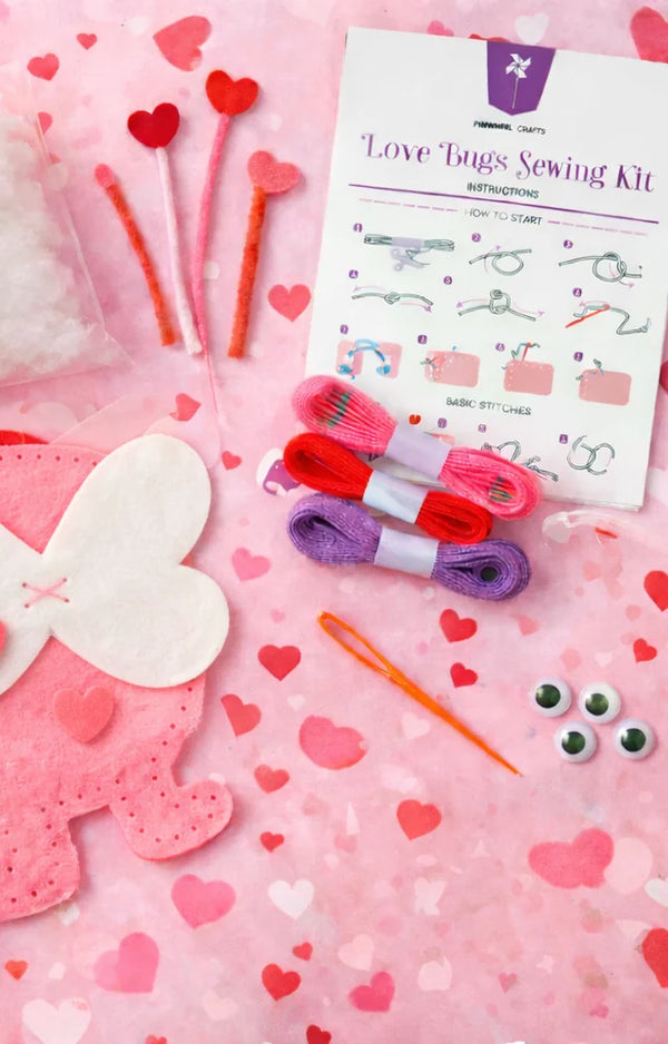 Love Bugs Sewing Kit contents laid flat: felt, thread, needle, googly eyes and stuffing