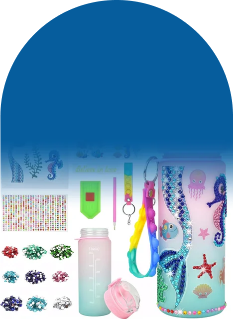 A pink and teal bottle, stickers, gems, and tools, all in one box