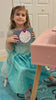 Girl opens the mermaid charm kit, strings beads and charms, and shows her finished bracelet