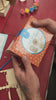 A boy and his dad build and paint three wooden music boxes, then turn the cranks to play them