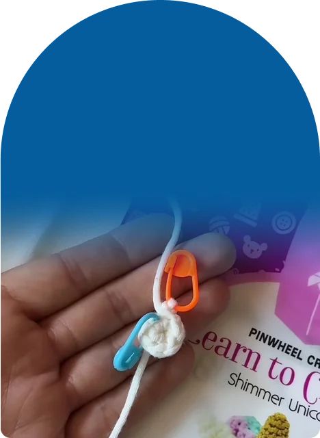 A pre-started magic ring, yarn, hook, safety eyes, and stuffing in one kit