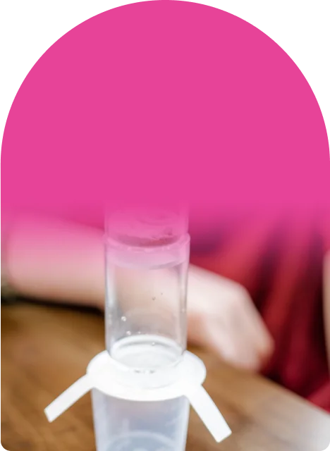 Pebbles, sand, and filter paper stacked in three clear chambers kids can see through